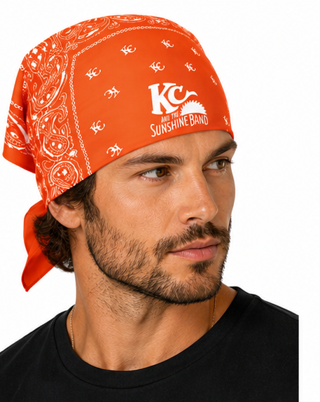 A man wearing an orange bandana with white KC and the Sunshine Band logos and text, photographed against a plain white background.