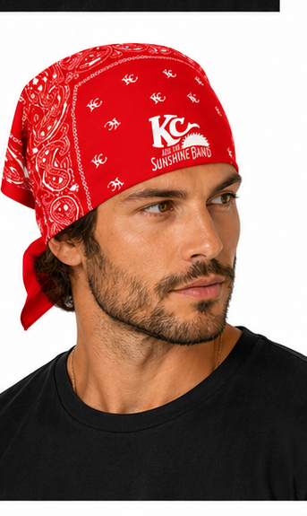 A man wearing a red bandana with a white paisley pattern and a white 'KC Sunshine Band' logo on the front, set against a plain white background.